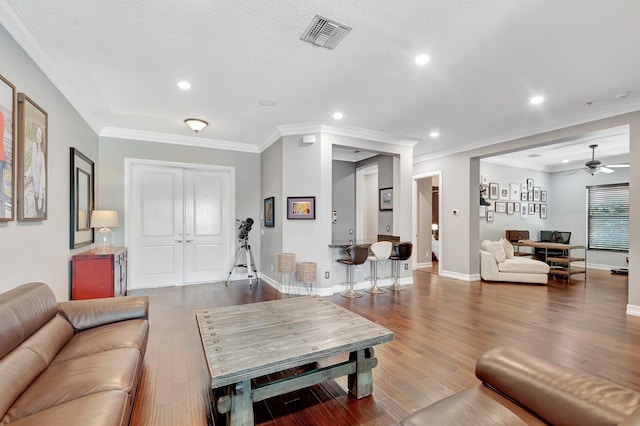 8979 Little Falls Way, Delray Beach, FL 33446 - living area featuring wood finished floors, recessed lighting, ceiling fan, baseboards, and crown molding