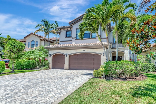 8979 Little Falls Way, Delray Beach, FL 33446 - mediterranean / spanish home with an attached garage, stucco siding, decorative driveway, and a tile roof