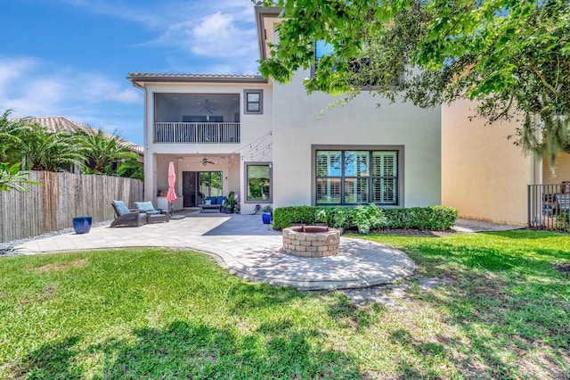 8979 Little Falls Way, Delray Beach, FL 33446 - rear view of property featuring ceiling fan, a fire pit, a patio area, and stucco siding