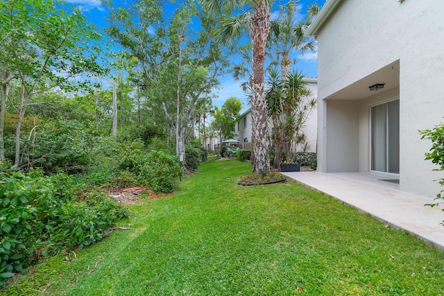 4718 NW 59th Mnr, Coconut Creek, FL 33073 - view of grassy yard featuring a patio area