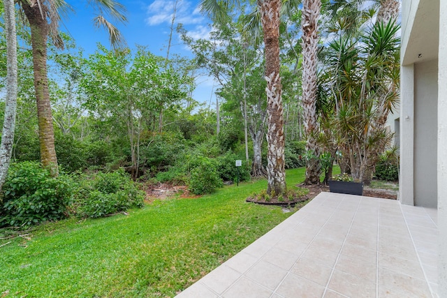 4718 NW 59th Mnr, Coconut Creek, FL 33073 - view of grassy yard featuring a patio area