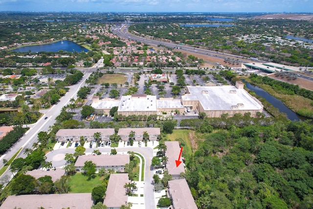 4718 NW 59th Mnr, Coconut Creek, FL 33073 - aerial view of property and surrounding area featuring a large body of water and nearby suburban area