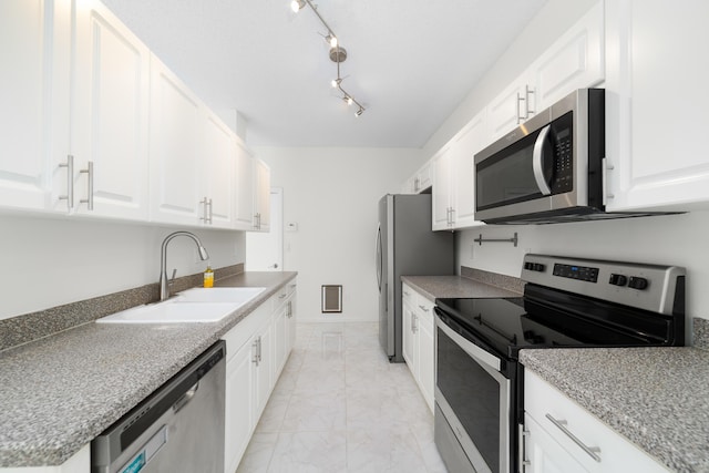 4718 NW 59th Mnr, Coconut Creek, FL 33073 - kitchen featuring stainless steel appliances, a sink, light marble finish flooring, and white cabinets