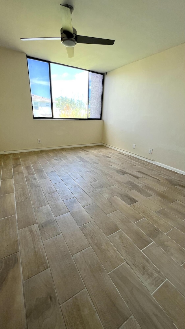 4345 Trevi Ct Unit 208, Lake Worth, FL 33467 - spare room featuring a ceiling fan, wood finished floors, and healthy amount of natural light