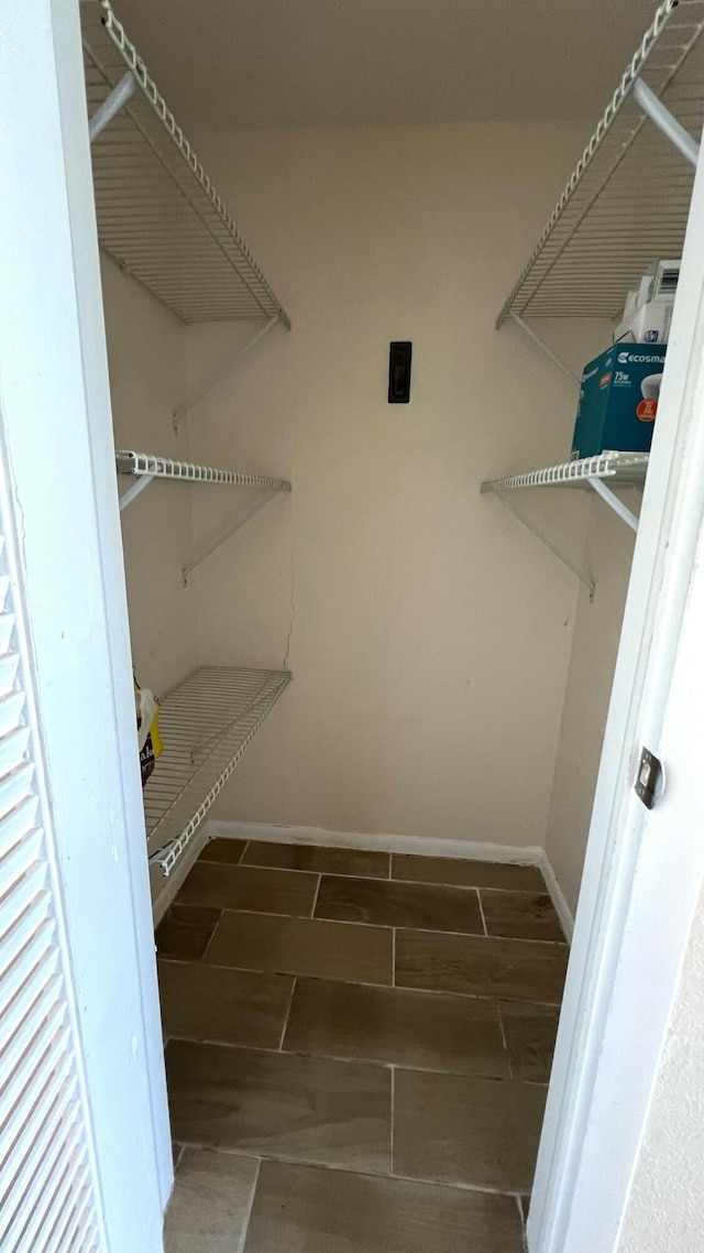 4345 Trevi Ct Unit 208, Lake Worth, FL 33467 - walk in closet with wood finish floors