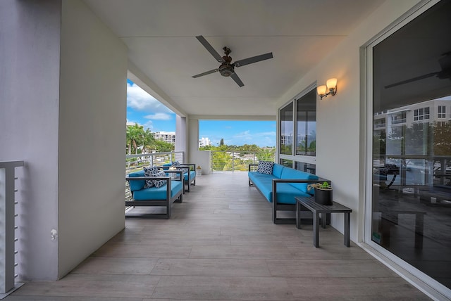 deck with ceiling fan and an outdoor hangout area
