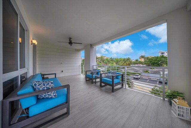 wooden deck with a ceiling fan