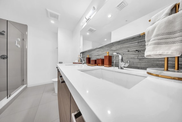 kitchen with light tile patterned floors, a sink, recessed lighting, decorative backsplash, and light countertops