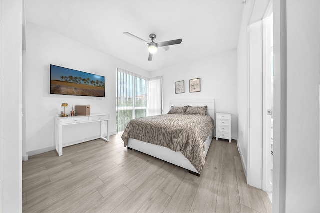 bedroom featuring light wood finished floors and ceiling fan