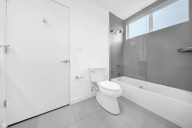 full bath featuring toilet, baseboards, shower / washtub combination, and tile patterned flooring