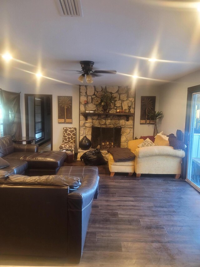 4832 Flynt Dr, Marianna, FL 32446 - living room featuring wood finished floors, a stone fireplace, and ceiling fan