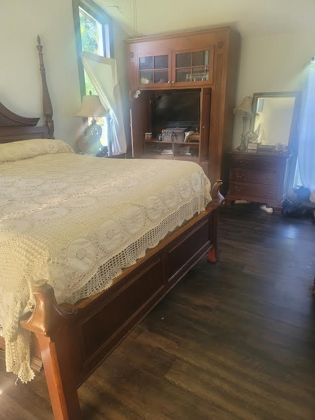 4832 Flynt Dr, Marianna, FL 32446 - bedroom with dark wood-style flooring