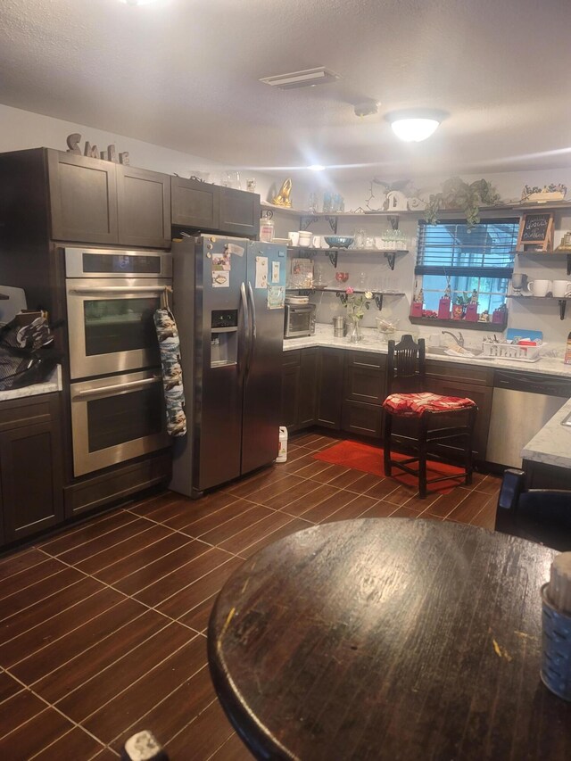 4832 Flynt Dr, Marianna, FL 32446 - kitchen featuring stainless steel appliances, open shelves, and light countertops