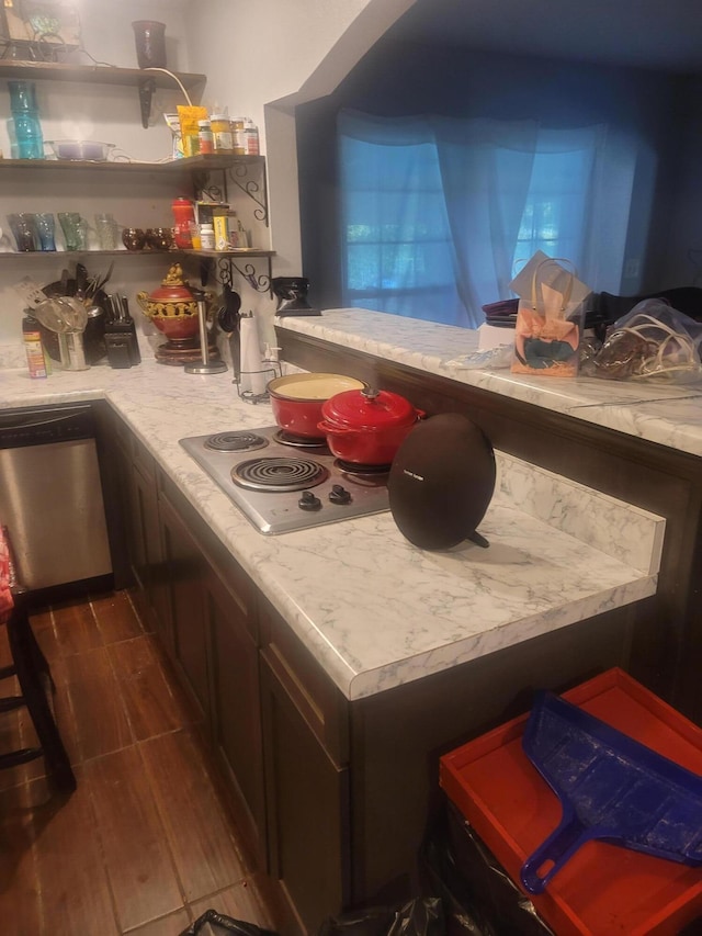 4832 Flynt Dr, Marianna, FL 32446 - kitchen with light countertops, dark wood finished floors, stainless steel dishwasher, and open shelves