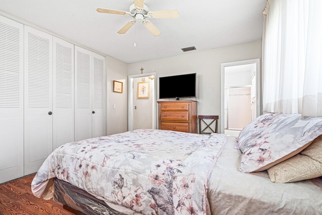 bedroom with a closet, wood finished floors, and ceiling fan