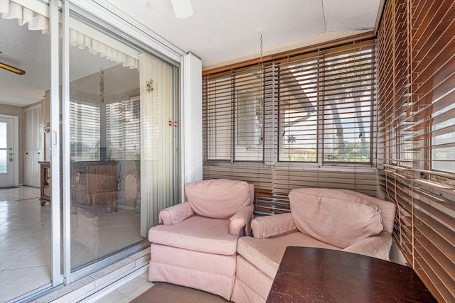 sunroom featuring healthy amount of natural light and tile patterned flooring