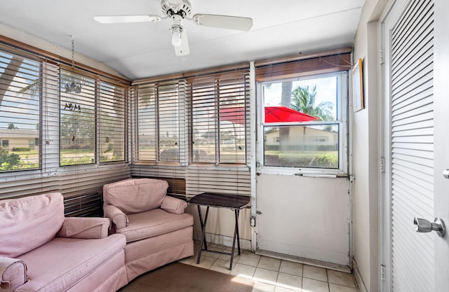 sunroom / solarium with lofted ceiling and ceiling fan