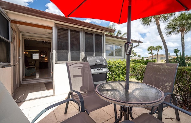view of patio with outdoor dining space and a grill