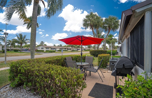 view of patio / terrace featuring grilling area and a residential view