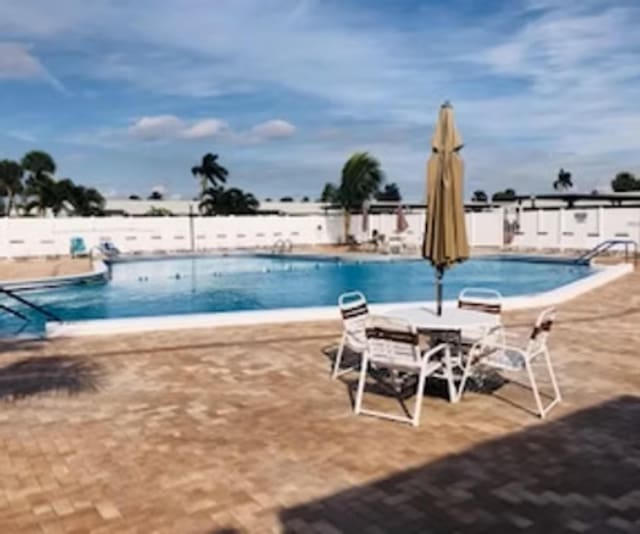 community pool featuring a patio area