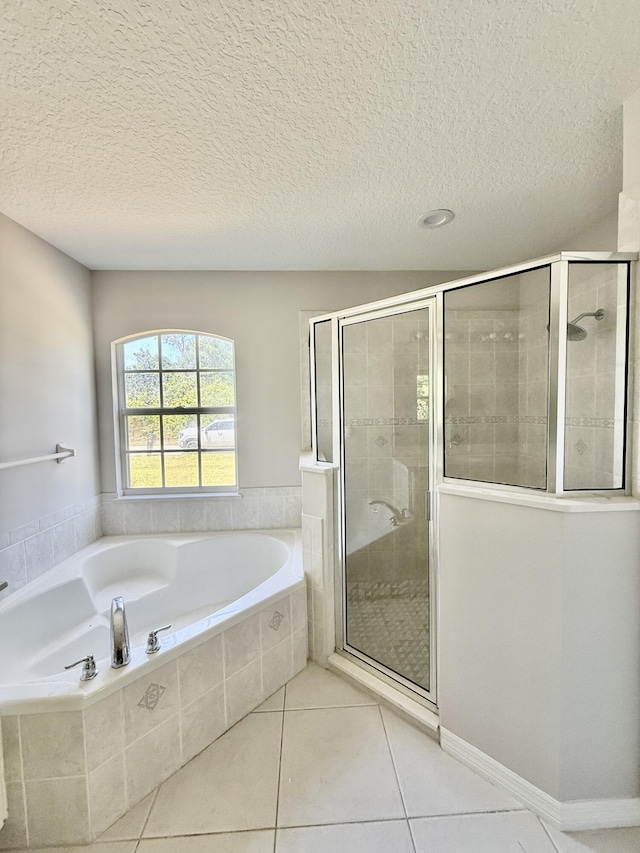 1744 SW Nantucket Ave, Port Saint Lucie, FL 34953 - bathroom with a stall shower, tile patterned flooring, a garden tub, and a textured ceiling