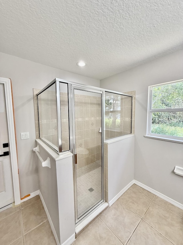 1744 SW Nantucket Ave, Port Saint Lucie, FL 34953 - full bath with a shower stall, tile patterned floors, baseboards, a textured ceiling, and recessed lighting