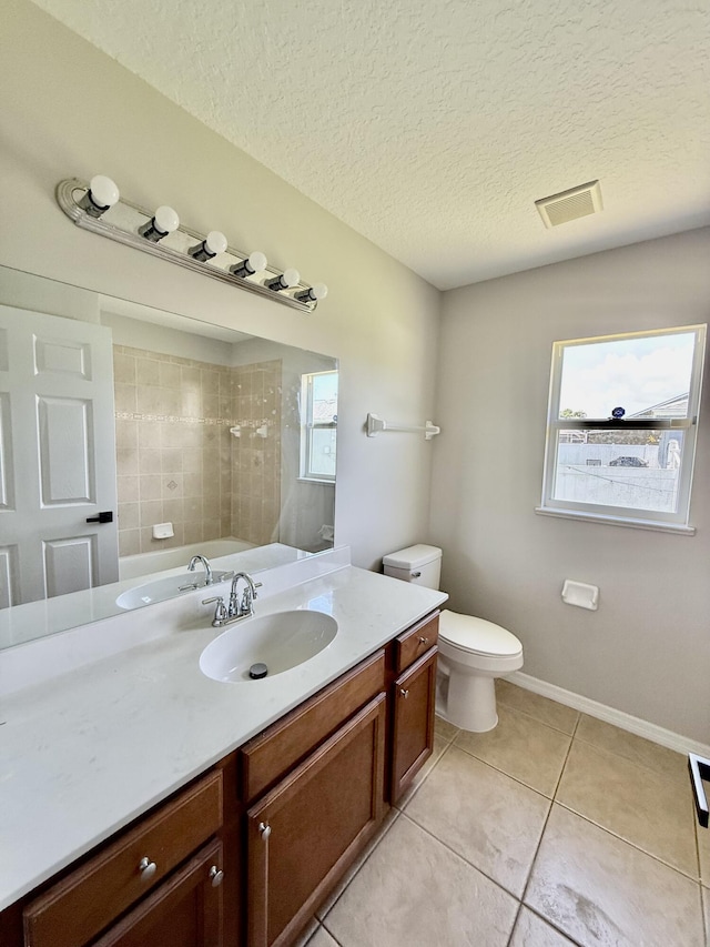 1744 SW Nantucket Ave, Port Saint Lucie, FL 34953 - bathroom with tile patterned floors, vanity, a shower, a textured ceiling, and toilet