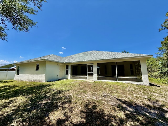 1744 SW Nantucket Ave, Port Saint Lucie, FL 34953 - back of house featuring a sunroom and stucco siding