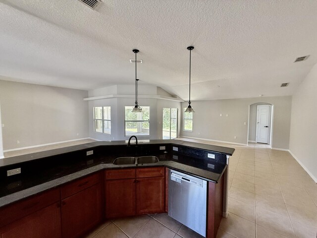 1744 SW Nantucket Ave, Port Saint Lucie, FL 34953 - kitchen featuring stainless steel dishwasher, open floor plan, a sink, light tile patterned floors, and a textured ceiling