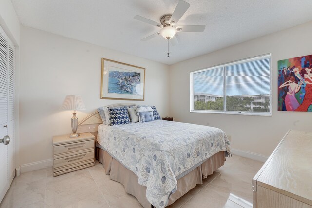 6698 10th Ave N Unit 320, Lake Worth, FL 33467 - bedroom with baseboards, a closet, and ceiling fan