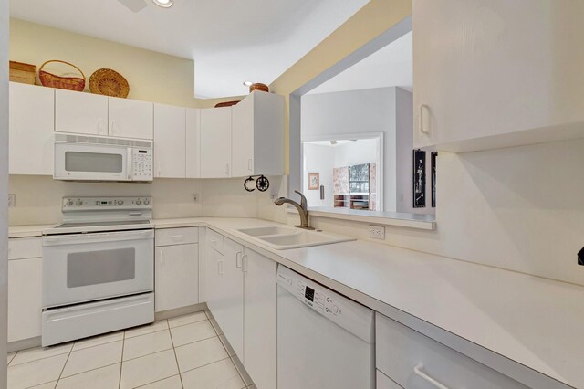 9564 Crescent View Dr N, Boynton Beach, FL 33437 - kitchen featuring white appliances, a sink, light countertops, and light tile patterned floors