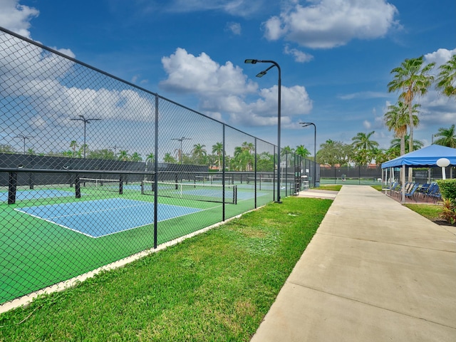 9564 Crescent View Dr N, Boynton Beach, FL 33437 - view of tennis court with fence