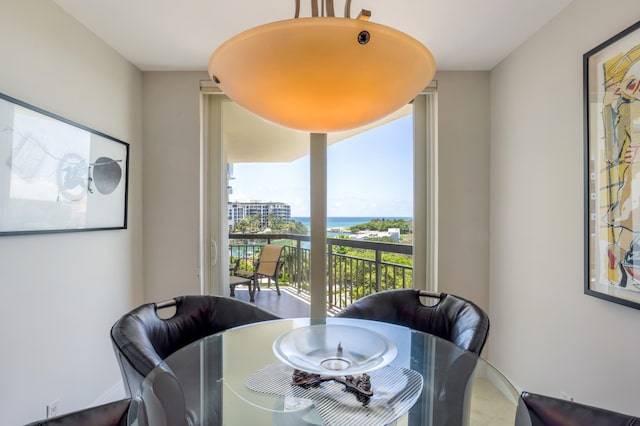 901 E Camino Real Unit 7C, Boca Raton, FL 33432 - dining space featuring a water view