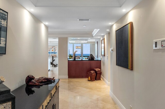 901 E Camino Real Unit 7C, Boca Raton, FL 33432 - hall featuring recessed lighting, a raised ceiling, baseboards, and crown molding