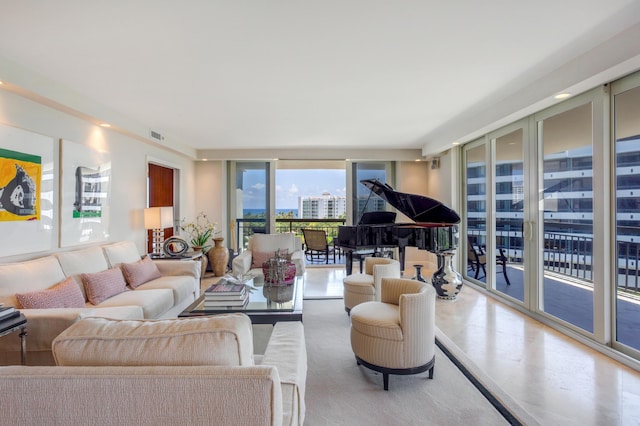 901 E Camino Real Unit 7C, Boca Raton, FL 33432 - living room featuring a wall of windows