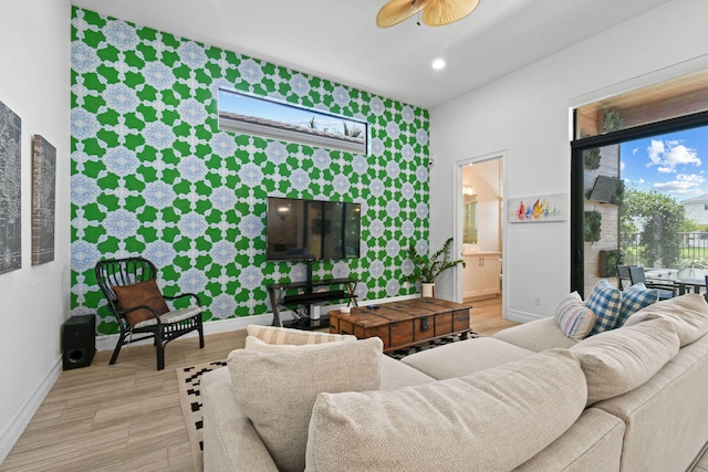 16323 Pantheon Pass, Delray Beach, FL 33446 - living area featuring baseboards, a ceiling fan, light wood finished floors, an accent wall, and wallpapered walls