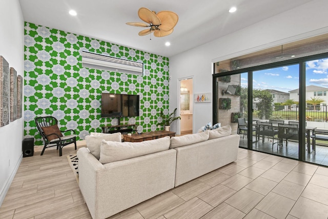 16323 Pantheon Pass, Delray Beach, FL 33446 - living area with an accent wall, baseboards, a ceiling fan, recessed lighting, and light wood-type flooring
