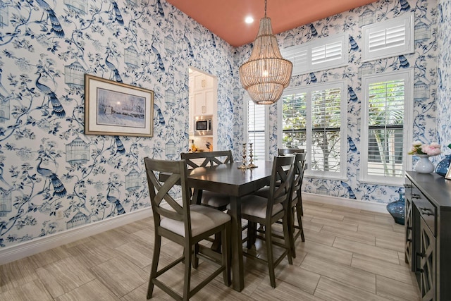 16323 Pantheon Pass, Delray Beach, FL 33446 - dining room with wallpapered walls, baseboards, and a chandelier