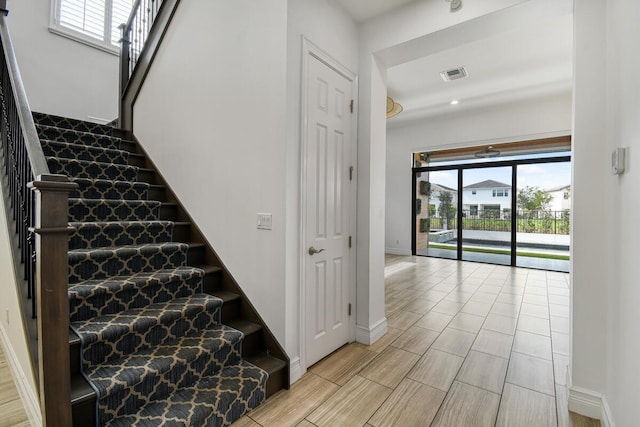 16323 Pantheon Pass, Delray Beach, FL 33446 - staircase with baseboards and wood finished floors