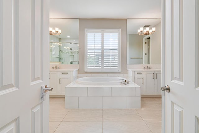 16323 Pantheon Pass, Delray Beach, FL 33446 - full bath with a chandelier, a stall shower, a garden tub, and tile patterned flooring