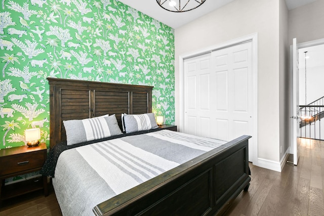 16323 Pantheon Pass, Delray Beach, FL 33446 - bedroom featuring dark wood-type flooring, wallpapered walls, a closet, and baseboards