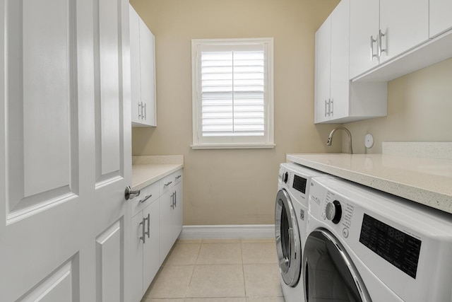 16323 Pantheon Pass, Delray Beach, FL 33446 - laundry room featuring washer and clothes dryer, cabinet space, baseboards, and light tile patterned floors