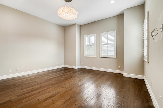 16323 Pantheon Pass, Delray Beach, FL 33446 - spare room with dark wood-style floors, a chandelier, baseboards, and recessed lighting