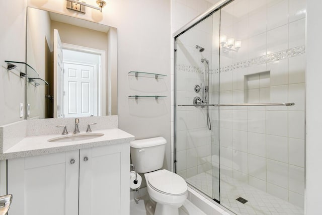 16323 Pantheon Pass, Delray Beach, FL 33446 - bathroom featuring toilet, a stall shower, and vanity