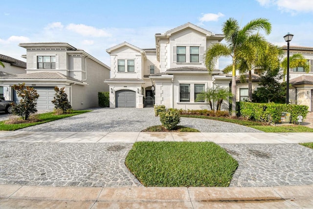 16323 Pantheon Pass, Delray Beach, FL 33446 - view of front of house featuring decorative driveway, an attached garage, and stucco siding