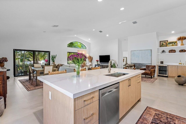 1175 Sea Grape Cir, Delray Beach, FL 33445 - kitchen with light brown cabinetry, wine cooler, a sink, open floor plan, and stainless steel dishwasher