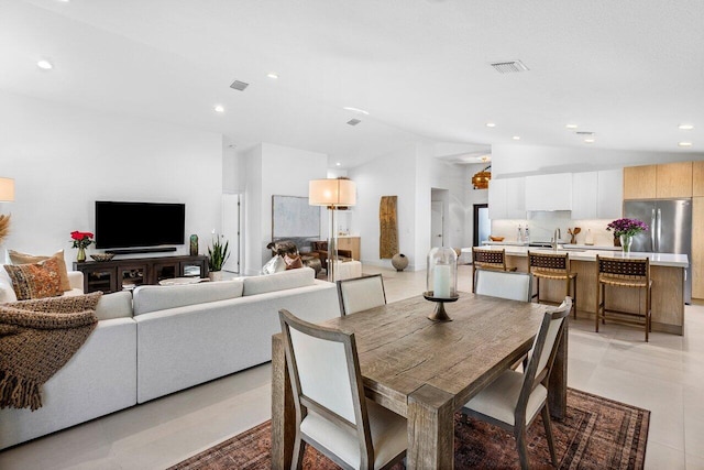 1175 Sea Grape Cir, Delray Beach, FL 33445 - dining space with vaulted ceiling and recessed lighting