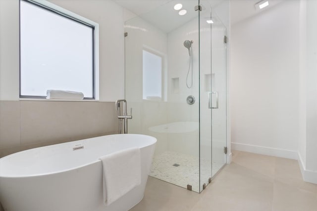 1175 Sea Grape Cir, Delray Beach, FL 33445 - full bathroom featuring a shower stall, a soaking tub, and baseboards