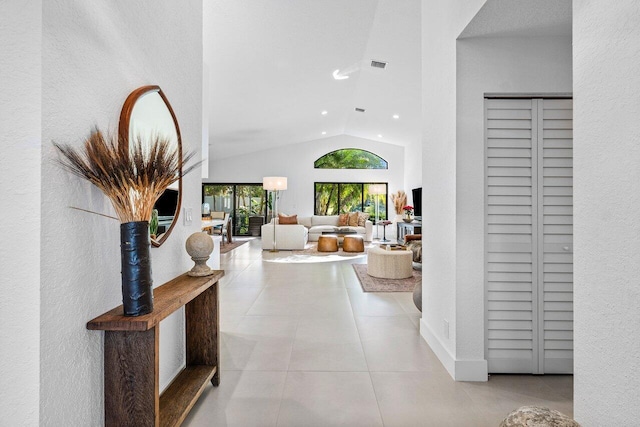 1175 Sea Grape Cir, Delray Beach, FL 33445 - hall with vaulted ceiling, tile patterned floors, and recessed lighting