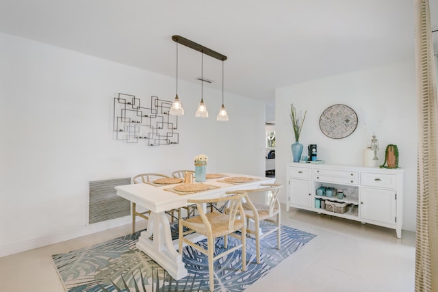 dining space featuring light tile patterned floors